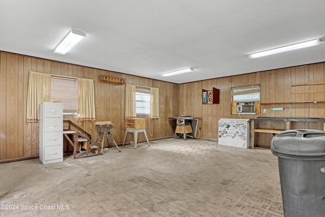 miscellaneous room featuring wood walls and cooling unit