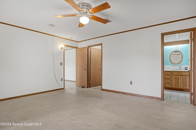 unfurnished room featuring ceiling fan and crown molding