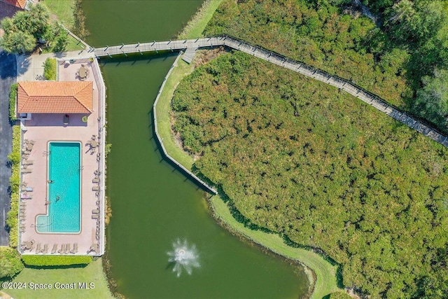 birds eye view of property with a water view