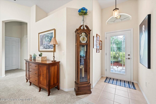 foyer with light colored carpet