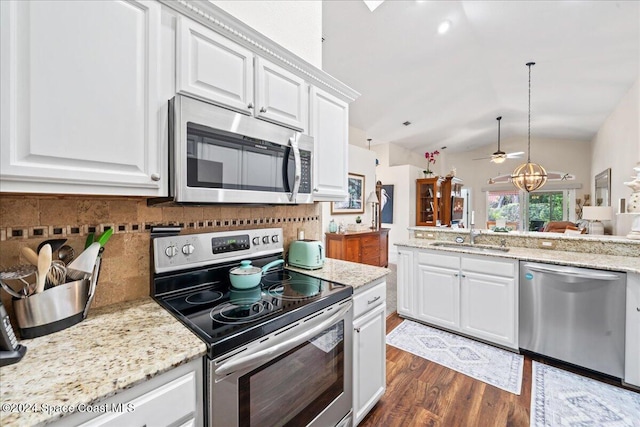 kitchen with white cabinetry, dark hardwood / wood-style floors, decorative light fixtures, ceiling fan with notable chandelier, and appliances with stainless steel finishes