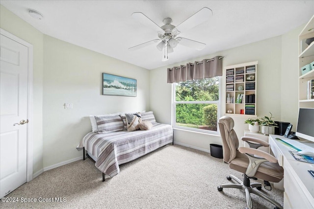 carpeted bedroom with ceiling fan