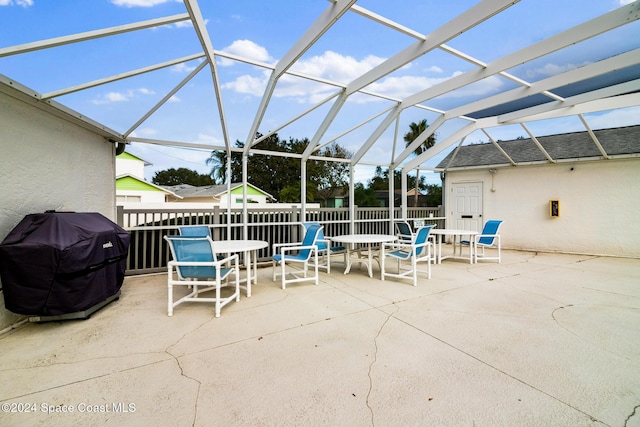 view of patio / terrace with a lanai and grilling area