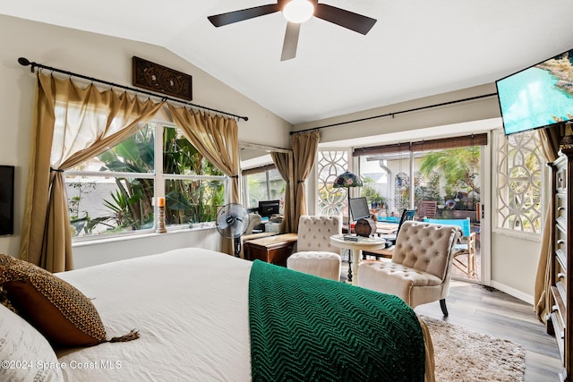 bedroom featuring light hardwood / wood-style floors, ceiling fan, and lofted ceiling