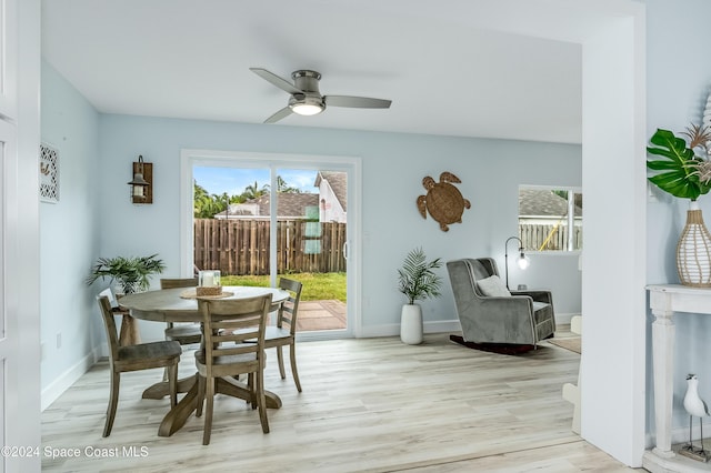 dining space featuring ceiling fan and light hardwood / wood-style floors