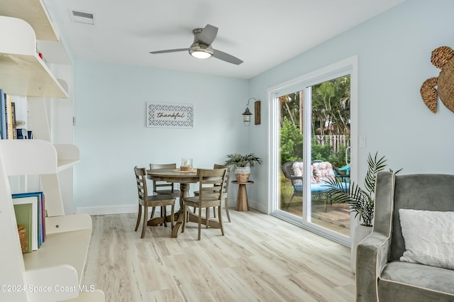 dining space featuring ceiling fan and light hardwood / wood-style flooring