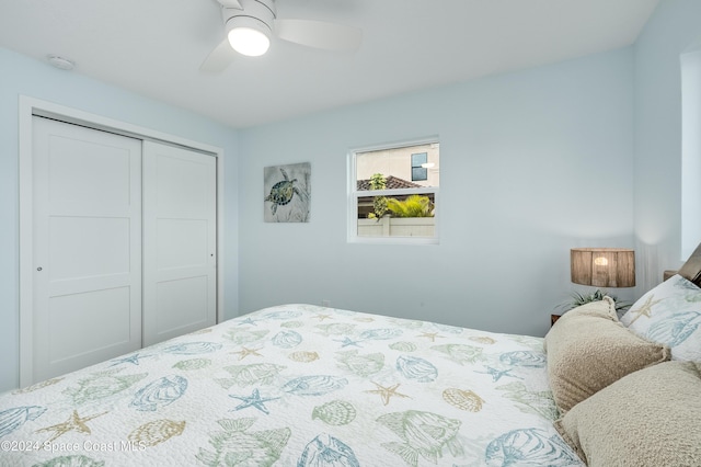 bedroom with ceiling fan and a closet