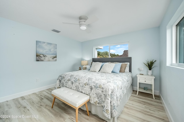 bedroom featuring light hardwood / wood-style floors and ceiling fan