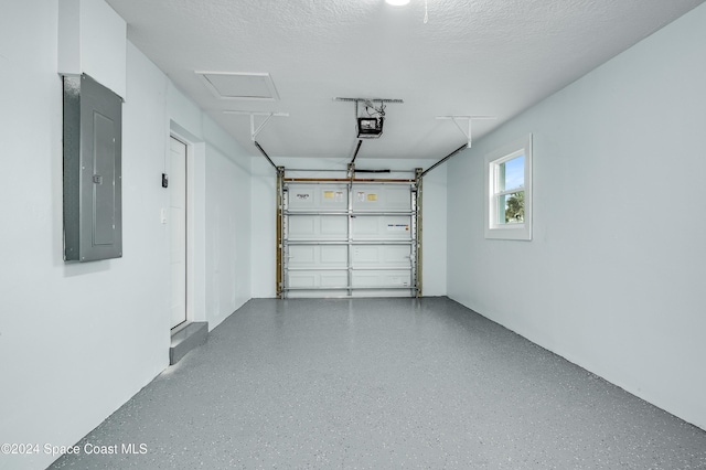 garage featuring electric panel and a garage door opener