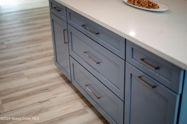 interior details featuring hardwood / wood-style flooring