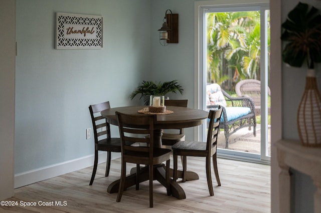 dining area with light hardwood / wood-style flooring