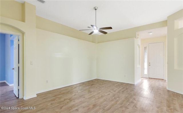 spare room with ceiling fan and light hardwood / wood-style floors