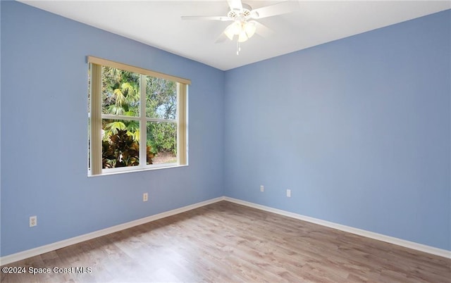 spare room with light hardwood / wood-style floors and ceiling fan