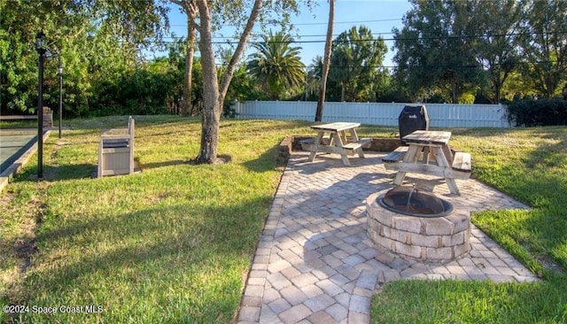 view of patio featuring a fire pit