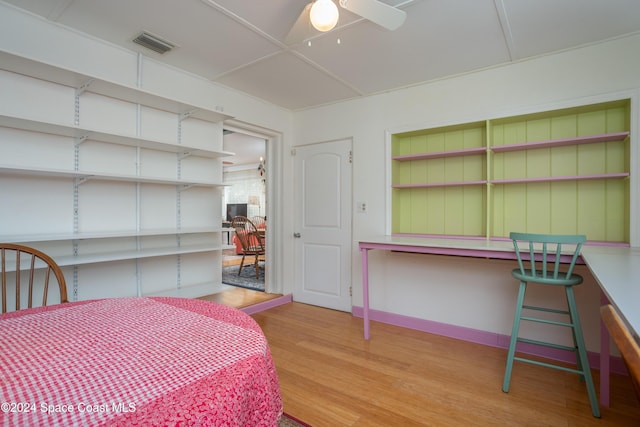 bedroom with ceiling fan and light hardwood / wood-style flooring