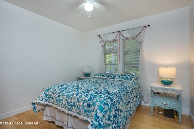 bedroom featuring hardwood / wood-style floors and ceiling fan