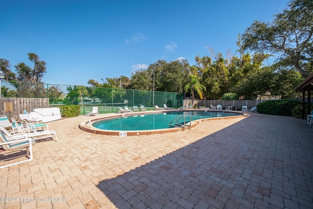 view of pool featuring a patio area