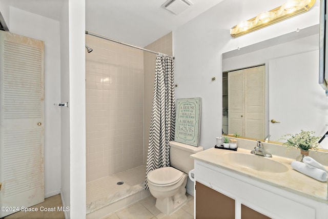 bathroom with tile patterned floors, vanity, a shower with shower curtain, and toilet