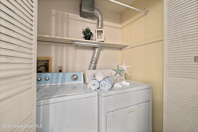 clothes washing area with independent washer and dryer