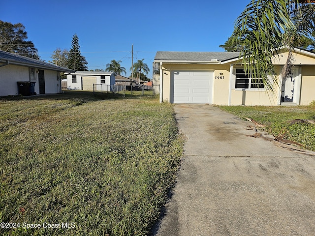 exterior space featuring a yard and a garage