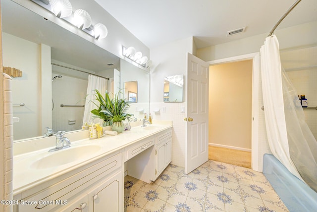 bathroom featuring vanity and shower / bath combo