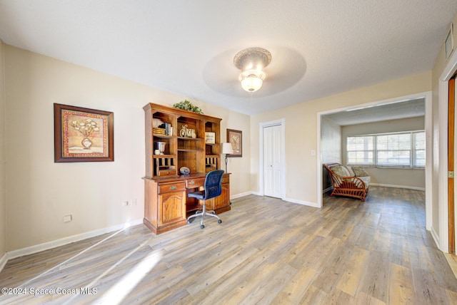 office area featuring ceiling fan and light hardwood / wood-style flooring