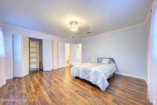 bedroom with ceiling fan, dark wood-type flooring, and ornamental molding