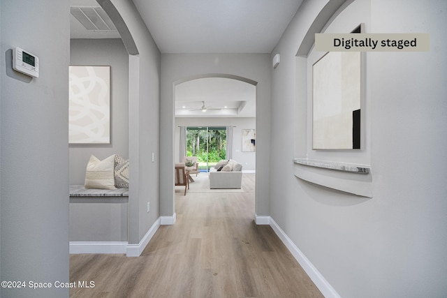 hallway with light wood-type flooring