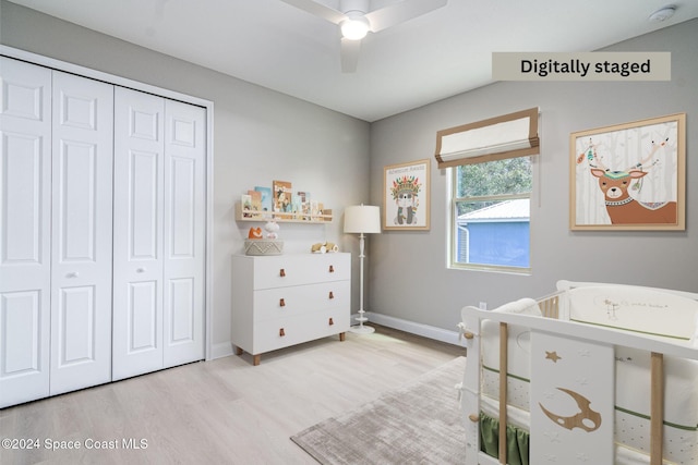 bedroom featuring ceiling fan, a closet, and light wood-type flooring