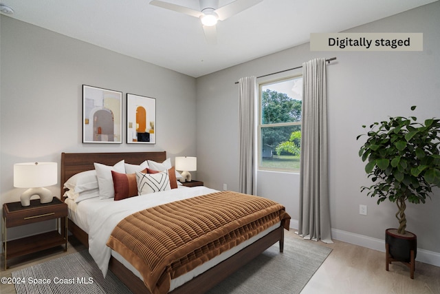 bedroom featuring ceiling fan and wood-type flooring