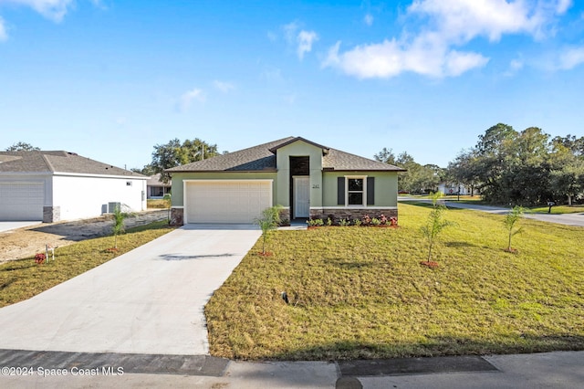 ranch-style house featuring a front yard, central AC, and a garage