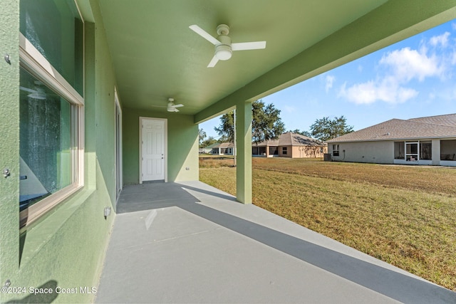 view of patio featuring ceiling fan