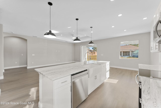 kitchen featuring light stone countertops, dishwasher, sink, decorative light fixtures, and white cabinets