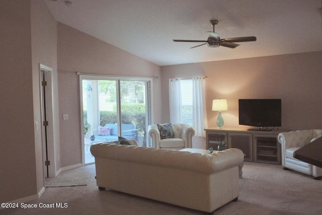 carpeted living room featuring lofted ceiling and ceiling fan