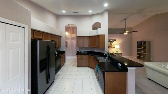 kitchen featuring sink, dishwasher, high vaulted ceiling, stainless steel refrigerator with ice dispenser, and kitchen peninsula