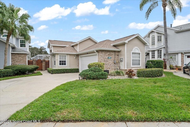 view of front of home featuring a garage and a front lawn