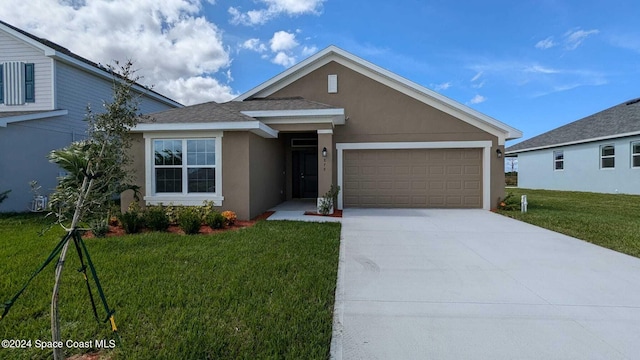 view of front facade featuring a garage and a front yard