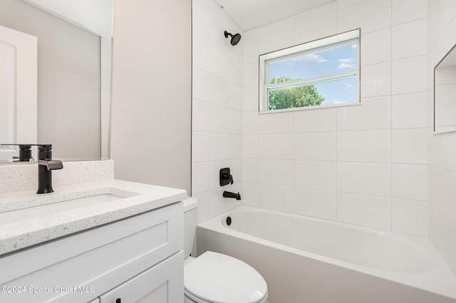 full bathroom with vanity, toilet, and tiled shower / bath combo