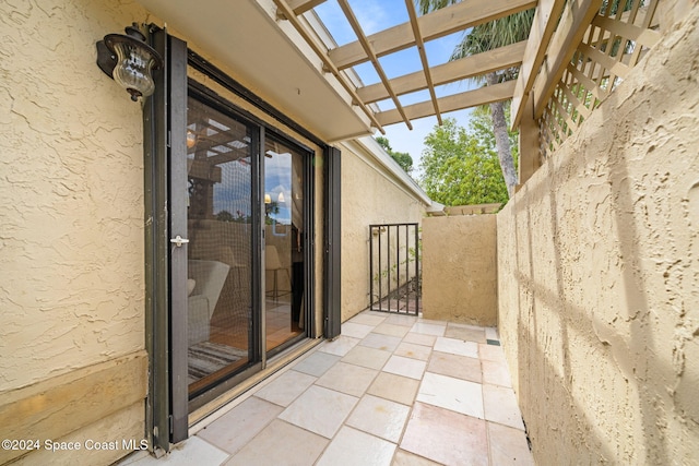 balcony featuring a pergola