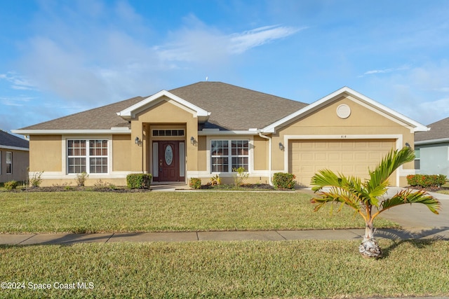 single story home with a front yard and a garage