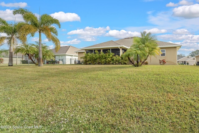 view of yard featuring a sunroom