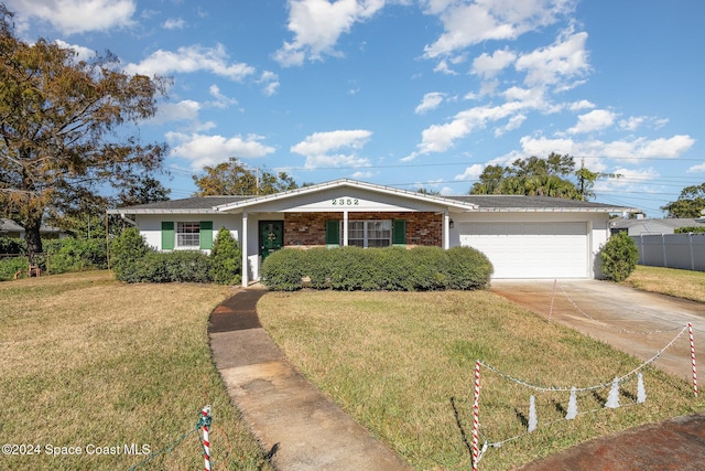 single story home with a garage and a front yard