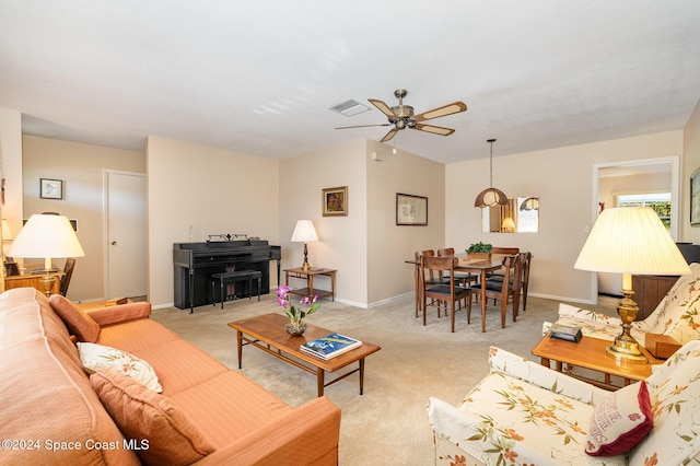 living room featuring light carpet and ceiling fan