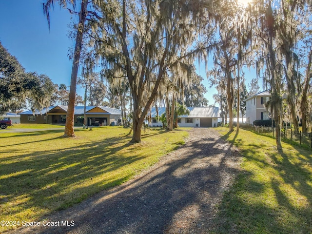 ranch-style home featuring a front yard