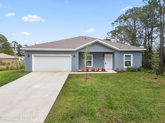 ranch-style home featuring a garage and a front yard