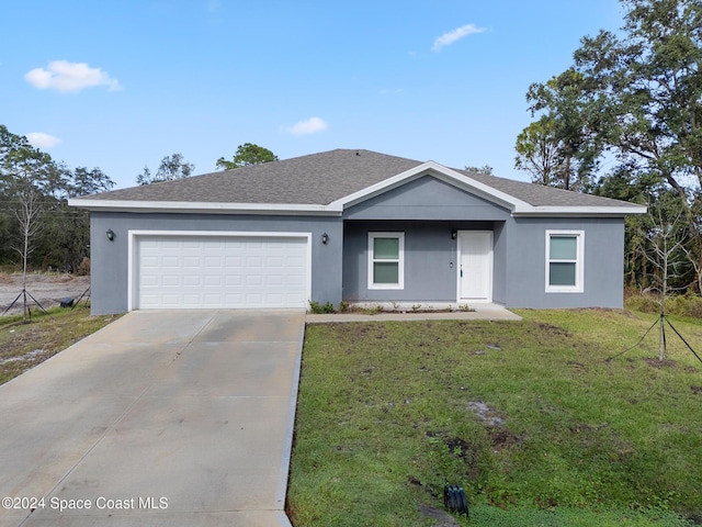 ranch-style home with a front yard and a garage