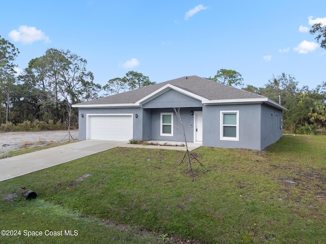 ranch-style house with a front lawn and a garage