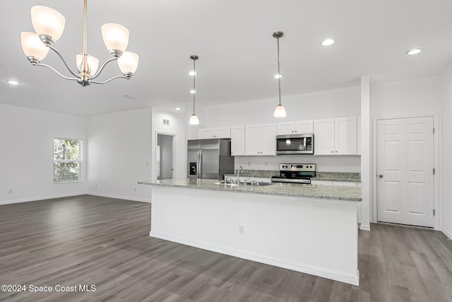 kitchen with stainless steel appliances, sink, hardwood / wood-style flooring, a center island with sink, and white cabinetry