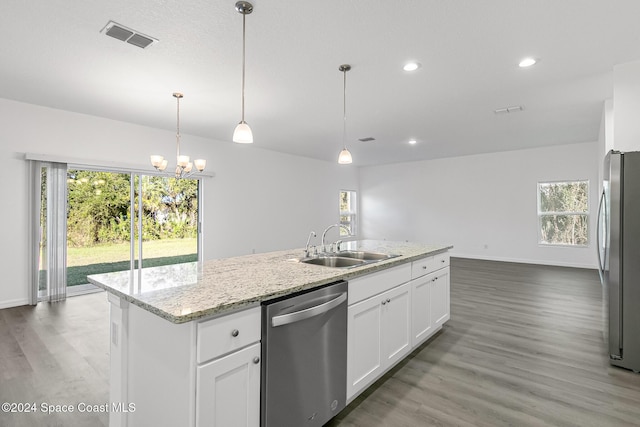 kitchen with white cabinets, plenty of natural light, sink, and appliances with stainless steel finishes