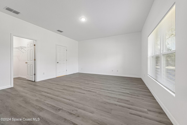 spare room with hardwood / wood-style floors